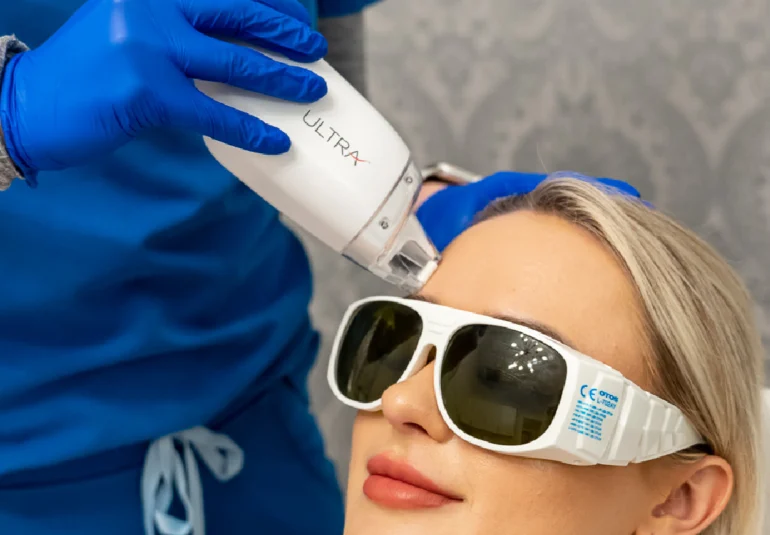 relive health hendersonville medspa employee administering Laser Skin Resurfacing treatment to patient with the Lutronic LaseMD Ultra 1600x733 1