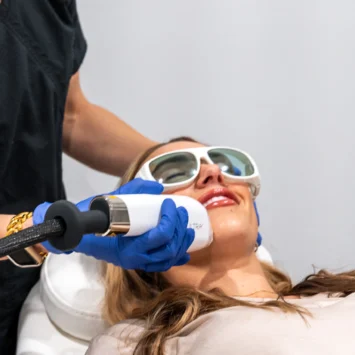 relive health hendersonville medspa employee administering Laser Skin Resurfacing treatment to patient with the Lutronic LaseMD Ultra 3 1600x733 1
